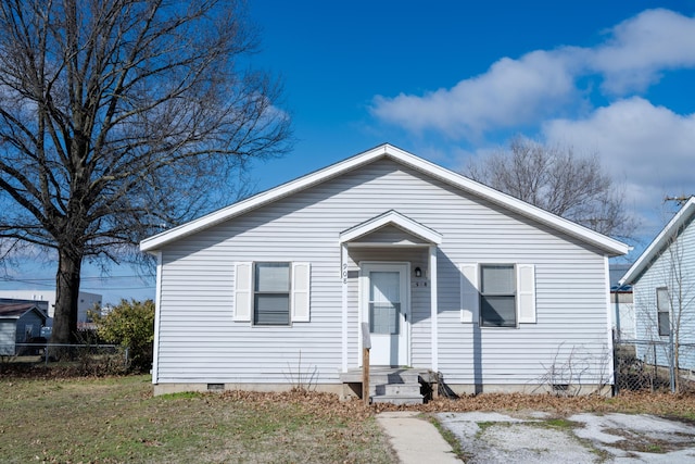 bungalow featuring crawl space, a front yard, and fence