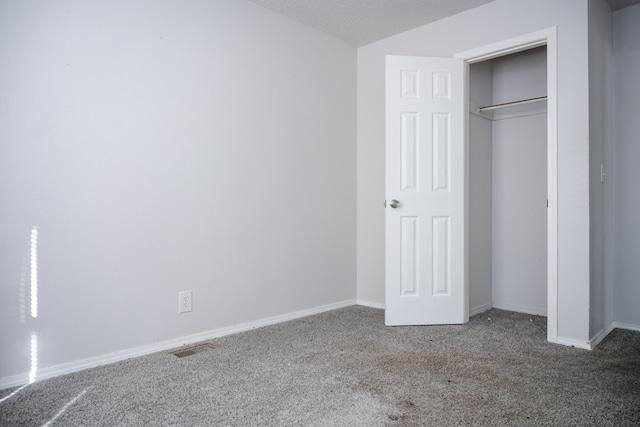 908 Jefferson Ave, Joplin, MO 64801 - unfurnished bedroom featuring carpet floors, baseboards, visible vents, and a closet