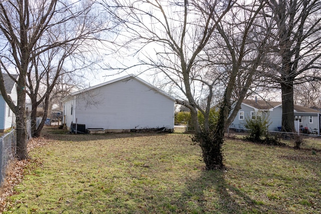 908 Jefferson Ave, Joplin, MO 64801 - view of home's exterior featuring fence and a lawn