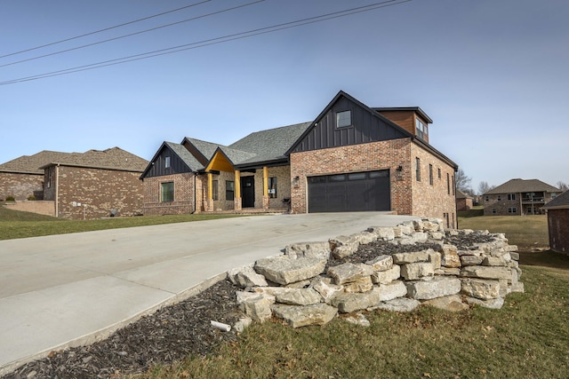 modern farmhouse style home with an attached garage, brick siding, board and batten siding, and concrete driveway