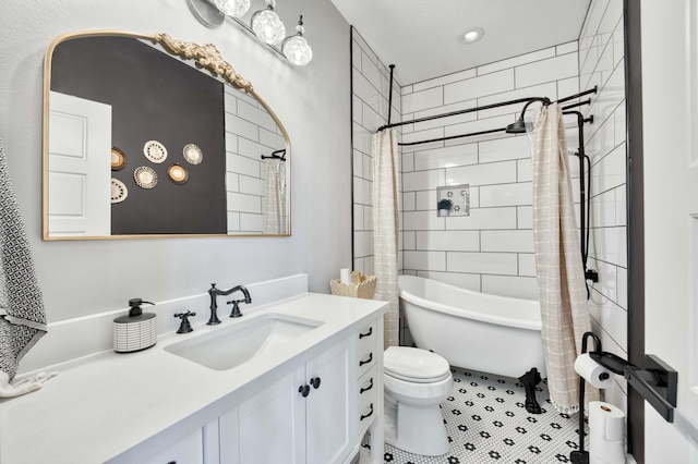 bathroom featuring toilet and vanity