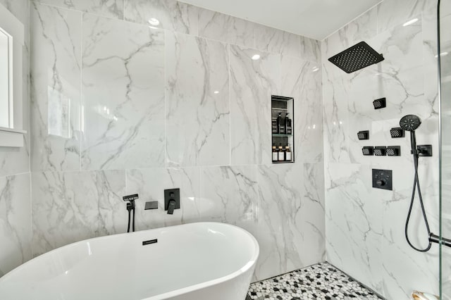 full bath with a soaking tub and a marble finish shower