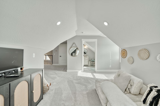 bedroom with a textured ceiling, recessed lighting, carpet floors, baseboards, and vaulted ceiling