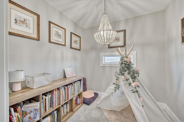 details with carpet floors, baseboards, and a notable chandelier