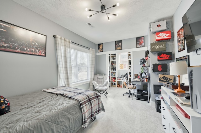 bedroom with an inviting chandelier, carpet, visible vents, and a textured ceiling