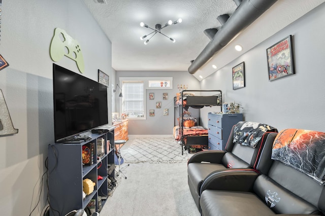 game room with carpet floors, a textured ceiling, and baseboards