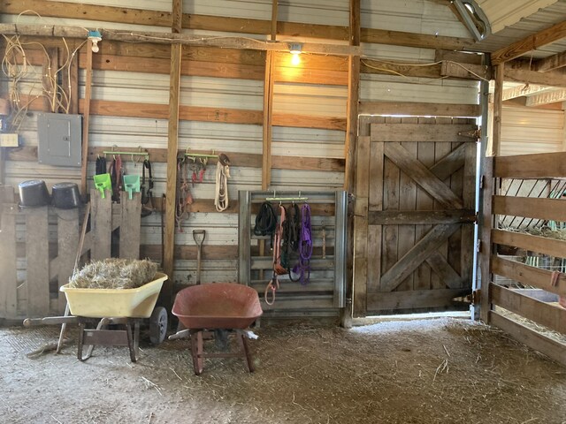 view of horse barn with electric panel