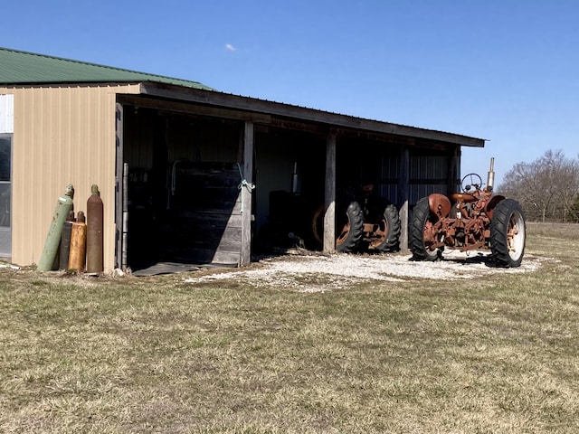 view of pole building with a lawn