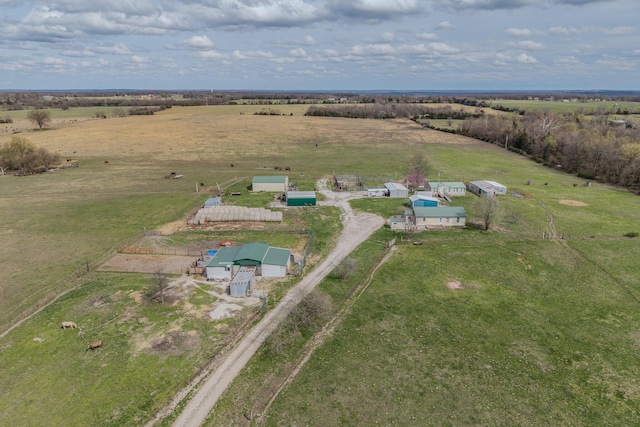 birds eye view of property with a rural view