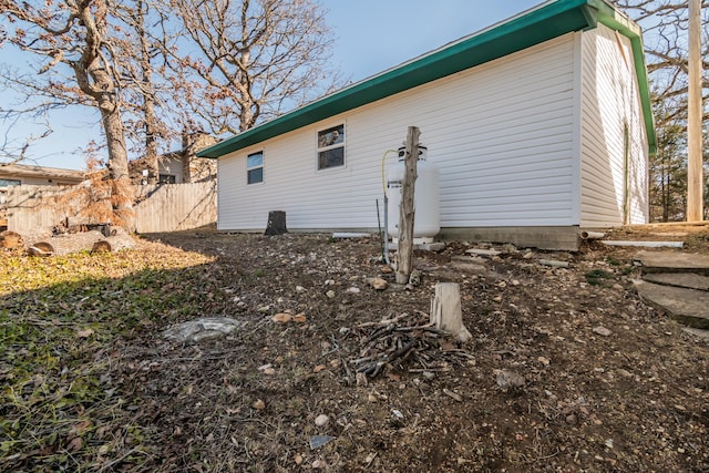 view of property exterior with fence