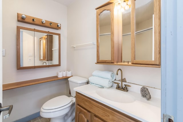 bathroom with toilet and vanity