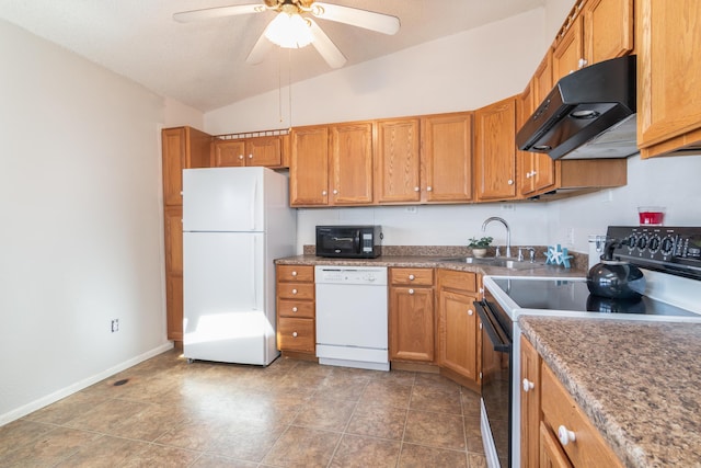 kitchen featuring lofted ceiling, brown cabinets, under cabinet range hood, black appliances, and a sink