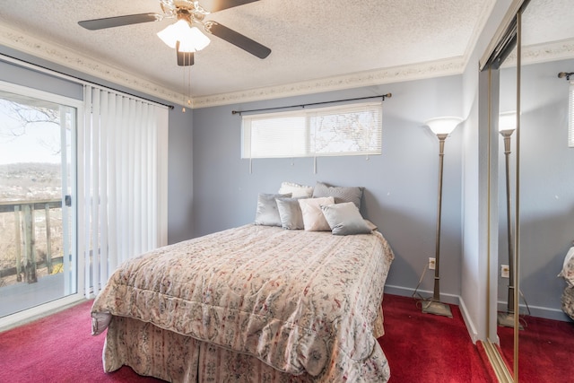 bedroom featuring baseboards, a ceiling fan, access to exterior, a textured ceiling, and carpet floors