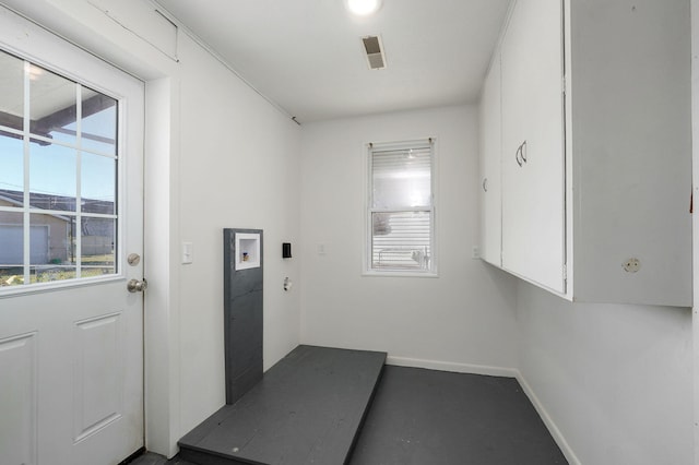 interior space featuring laundry area, washer hookup, and baseboards