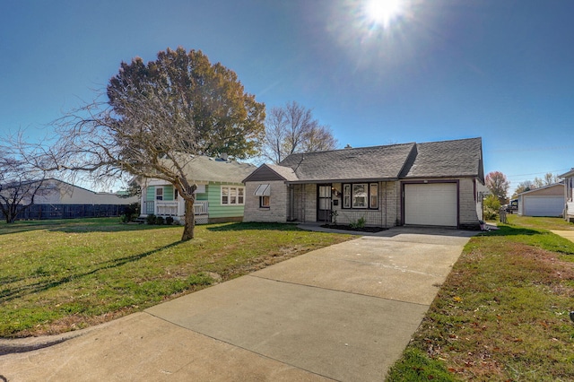 view of front facade featuring a garage, concrete driveway, brick siding, and a front yard