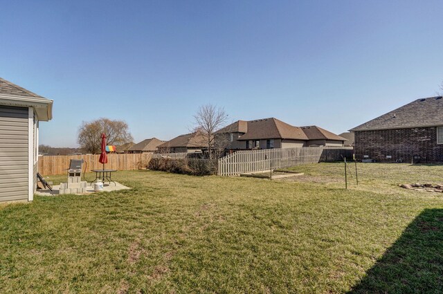 view of yard with a fenced backyard and a patio