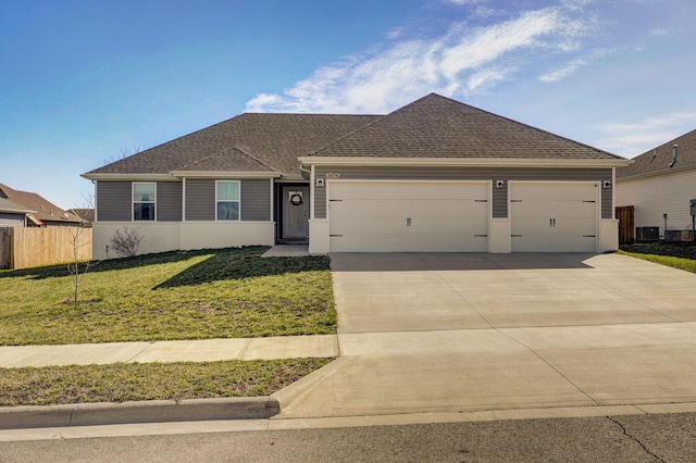 ranch-style house featuring a garage, concrete driveway, roof with shingles, fence, and a front yard