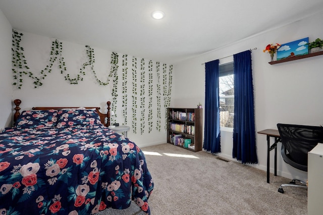 bedroom with carpet floors and baseboards