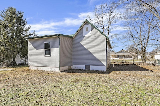 view of side of property featuring fence