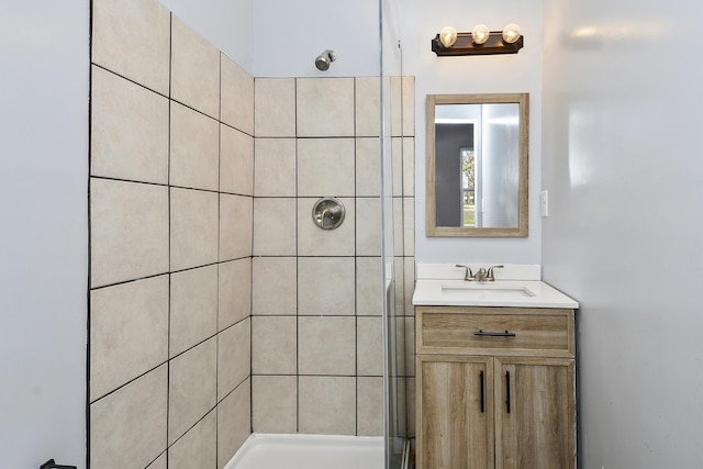 bathroom with a stall shower and vanity