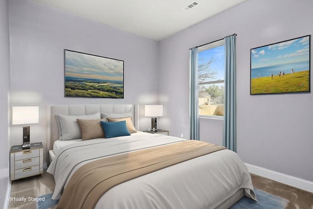 bedroom with baseboards, carpet flooring, and visible vents