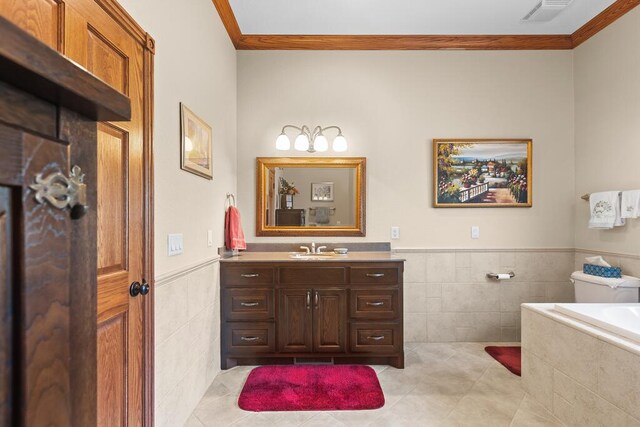 full bathroom with tile patterned flooring, a wainscoted wall, visible vents, and tile walls