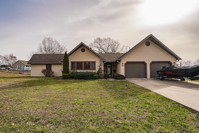 single story home featuring a garage, driveway, and a front lawn