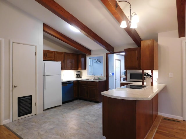 kitchen featuring light countertops, visible vents, white appliances, a peninsula, and baseboards