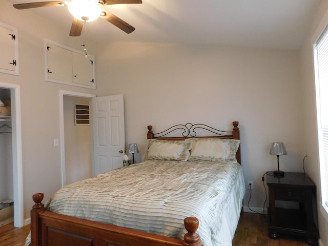 bedroom featuring vaulted ceiling, wood finished floors, and a ceiling fan