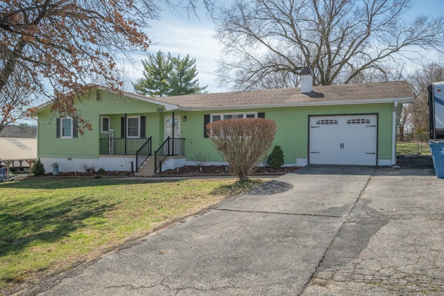 view of front of house with a chimney, concrete driveway, crawl space, a garage, and a front lawn