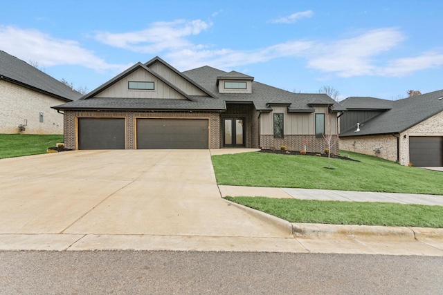 3941 E Woodhue St, Springfield, MO 65802 - view of front facade featuring brick siding, board and batten siding, a front lawn, and an attached garage