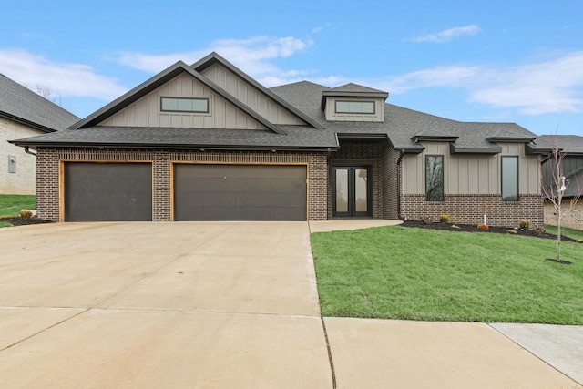 3941 E Woodhue St, Springfield, MO 65802 - view of front facade with brick siding, board and batten siding, a garage, concrete driveway, and a front lawn