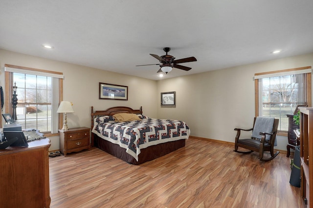 bedroom featuring light wood finished floors, recessed lighting, a ceiling fan, and baseboards