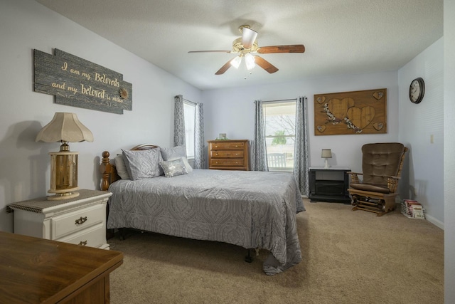 bedroom with carpet and a ceiling fan