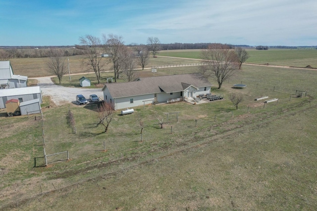 birds eye view of property with a rural view