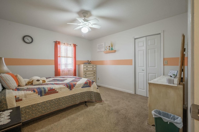 bedroom with a closet, carpet flooring, ceiling fan, and baseboards