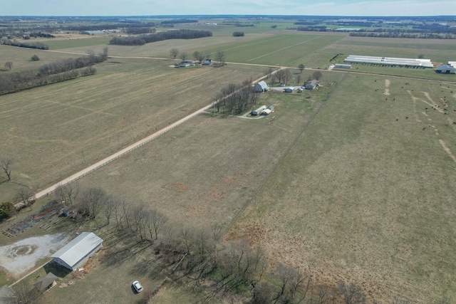 birds eye view of property featuring a rural view