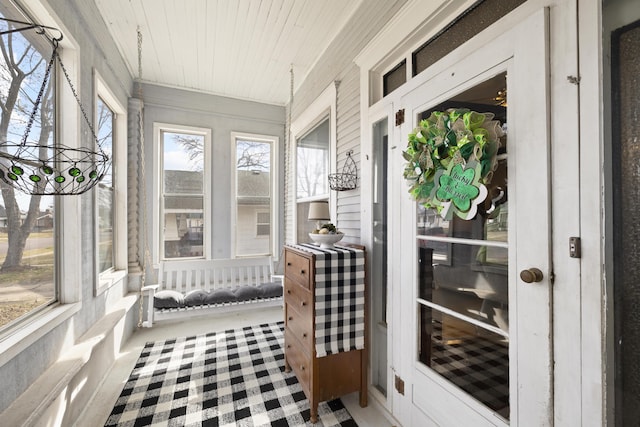 sunroom / solarium featuring wood ceiling