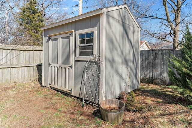 view of shed featuring a fenced backyard