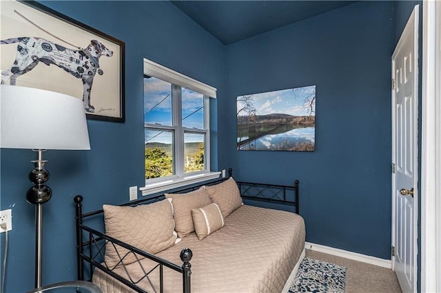 bedroom with carpet and baseboards