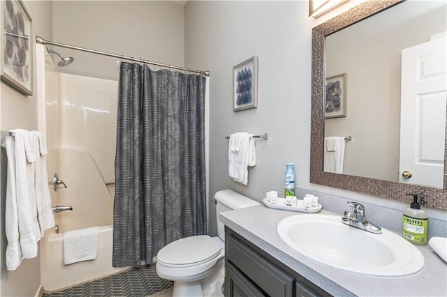 bathroom featuring toilet, shower / tub combo, and vanity