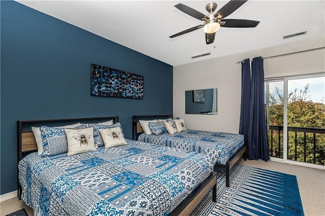 carpeted bedroom featuring visible vents and ceiling fan