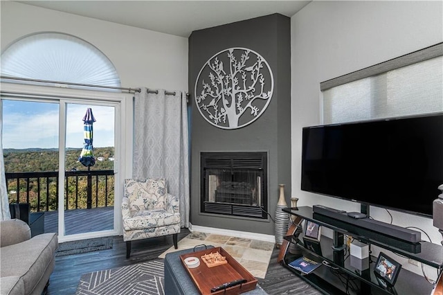 living area featuring a large fireplace