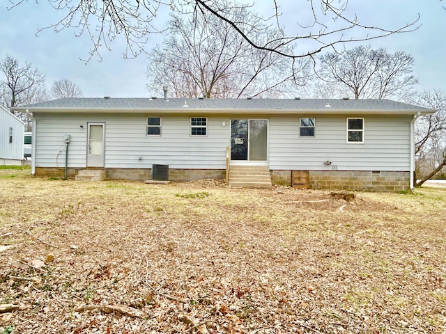 back of house with entry steps and crawl space