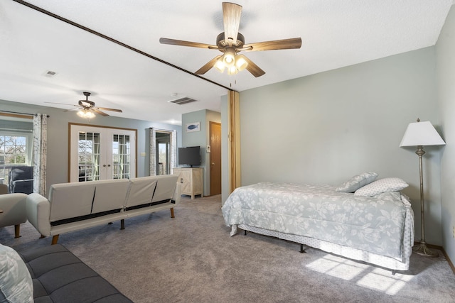 bedroom featuring ceiling fan, french doors, carpet flooring, and visible vents