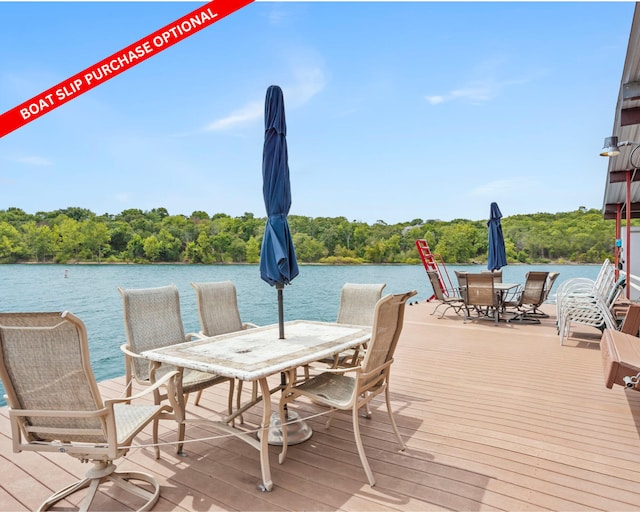 dock area featuring a water view and a view of trees