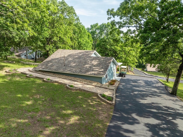 466 Buck Run Dr, Branson West, MO 65737 - view of side of home with a yard and roof with shingles