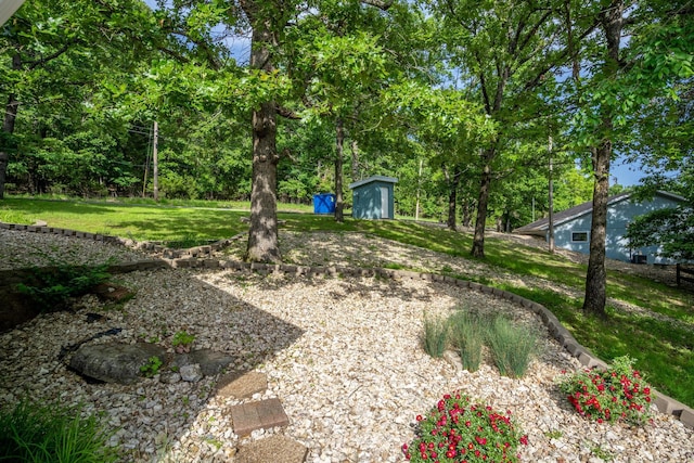 466 Buck Run Dr, Branson West, MO 65737 - view of grassy yard with a shed and an outdoor structure