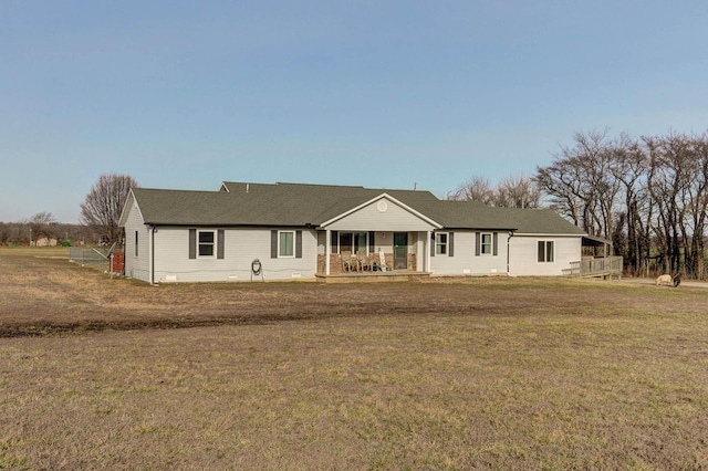 single story home with covered porch and a front yard