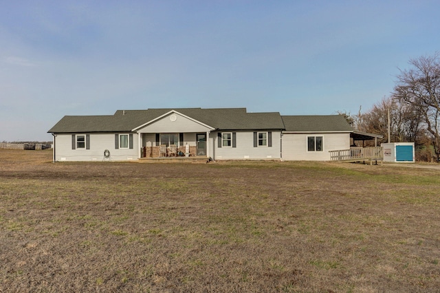 back of house featuring a lawn